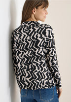 Mysig tröja med grafiskt mönster