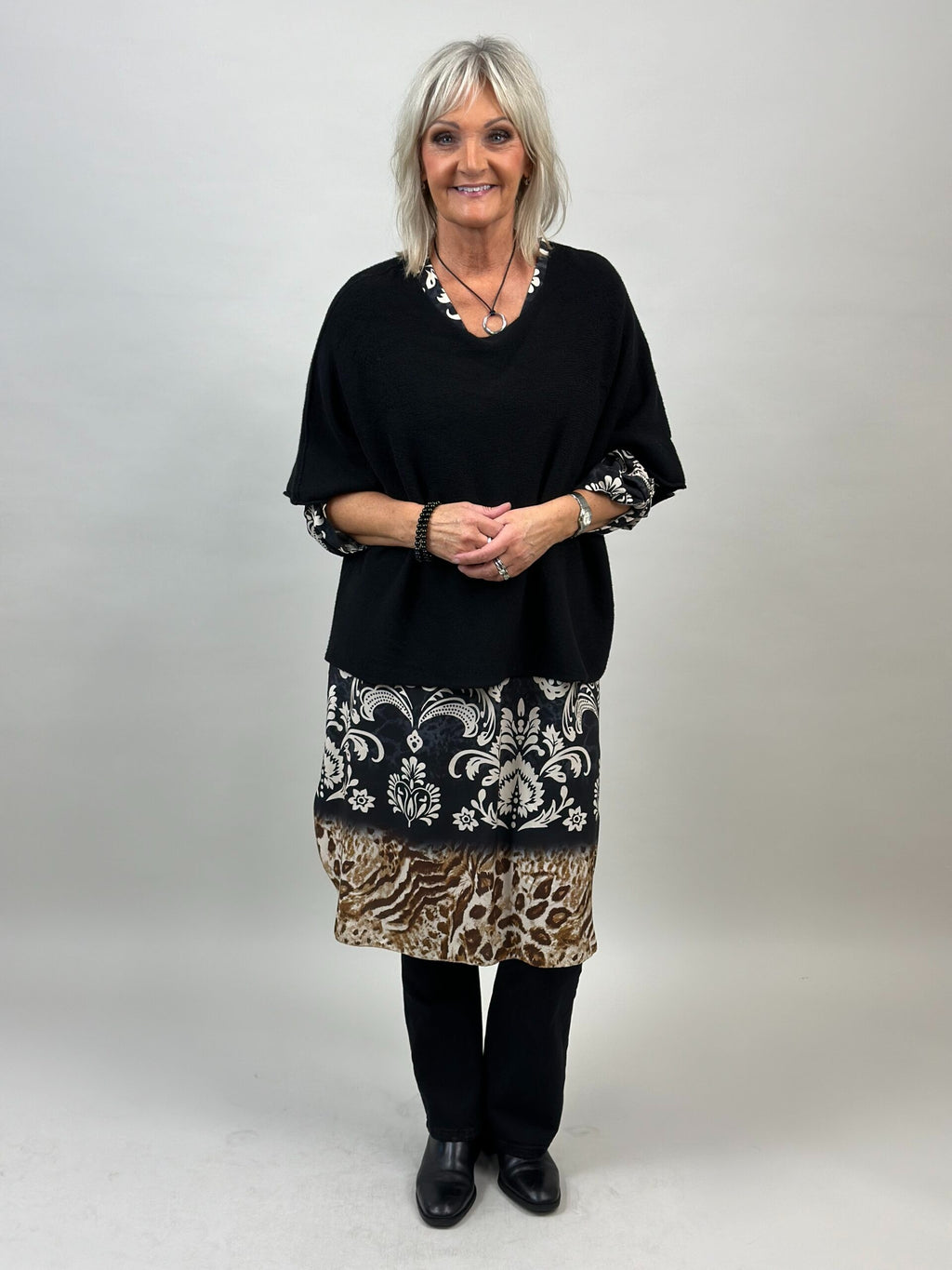 Ponchotröja Nessa svart